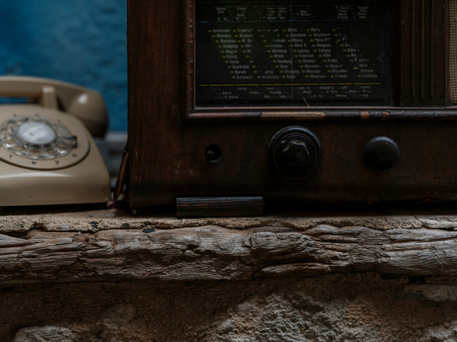 a close up of an old fashioned phone on a ledge